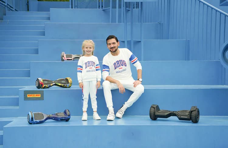 child and person with hoverboards